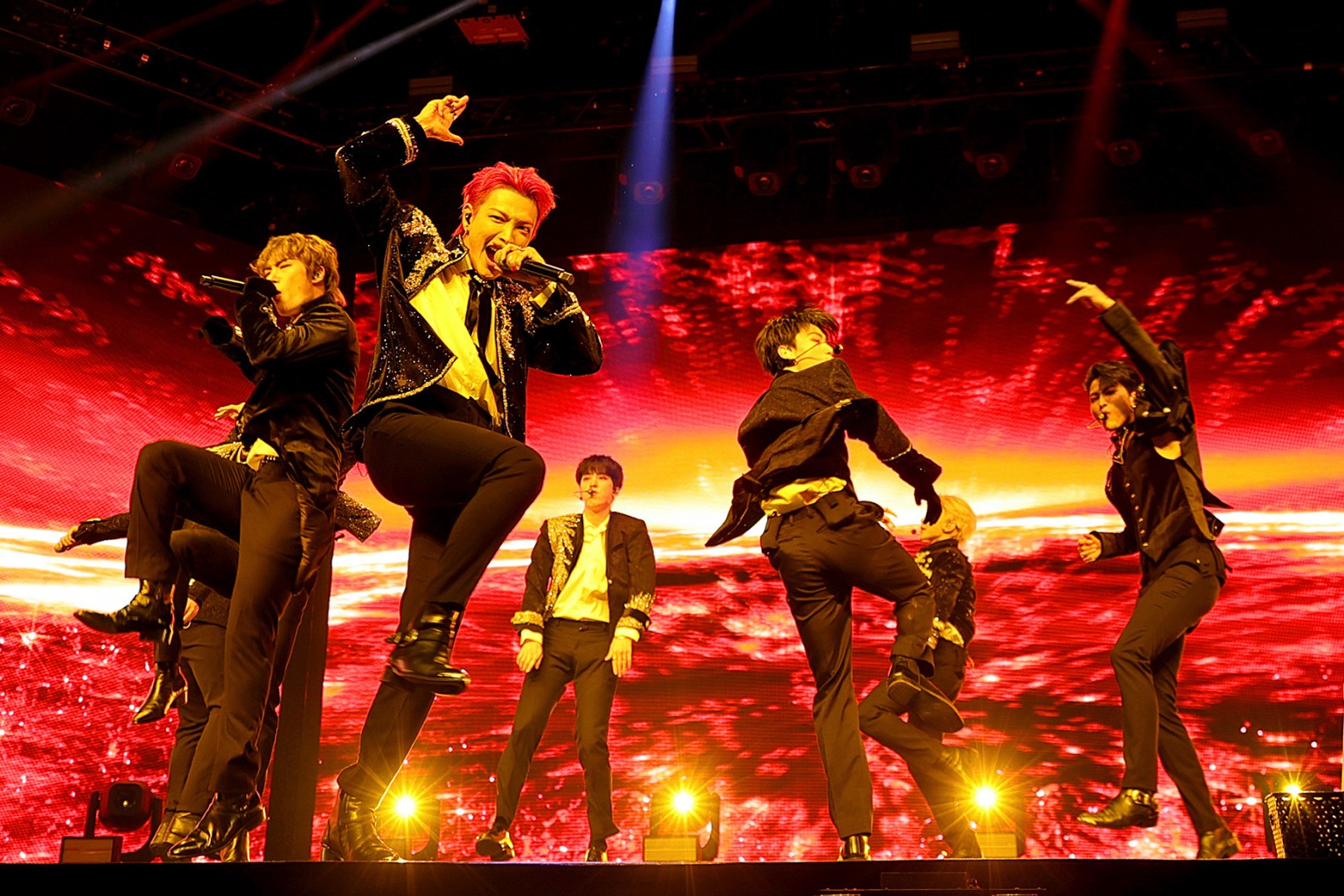 ATEEZ performing on stage during their world tour